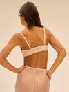 Model wearing 'Essentiel' Pale Pink Multi-Position Strapless Bra, by Simone Pérèle (back view)