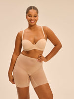 Model wearing 'Essentiel' Pale Pink Multi-Position Strapless Bra, by Simone Pérèle (front view)