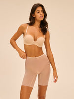 Model wearing 'Essentiel' Pale Pink Multi-Position Strapless Bra, by Simone Pérèle (front view)