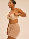 Model wearing 'Essentiel' Pale Pink Multi-Position Strapless Bra, by Simone Pérèle (side view)