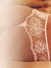 Model wearing 'Intrigue' Pale Pink Tanga, by Simone Pérèle (back view, close up detail).