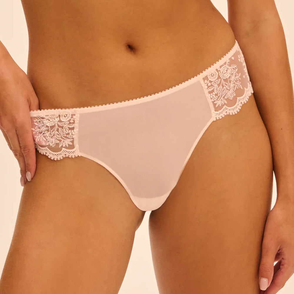 Model wearing 'Intrigue' Pale Pink Tanga, by Simone Pérèle (front view, close up).