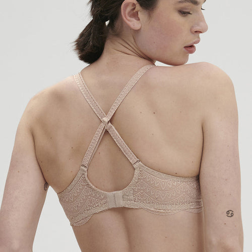 Model wearing 'Karma' Beige Pink 3D Moulded Bra, by Simone Pérèle (back view).