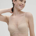Model wearing 'Karma' Beige Pink 3D Moulded Bra, by Simone Pérèle (front view).