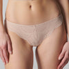 Model wearing 'Karma' Pale Pink Tanga, by Simone Pérèle (front view, close up).