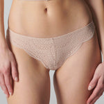 Model wearing 'Karma' Pale Pink Tanga, by Simone Pérèle (front view, close up).