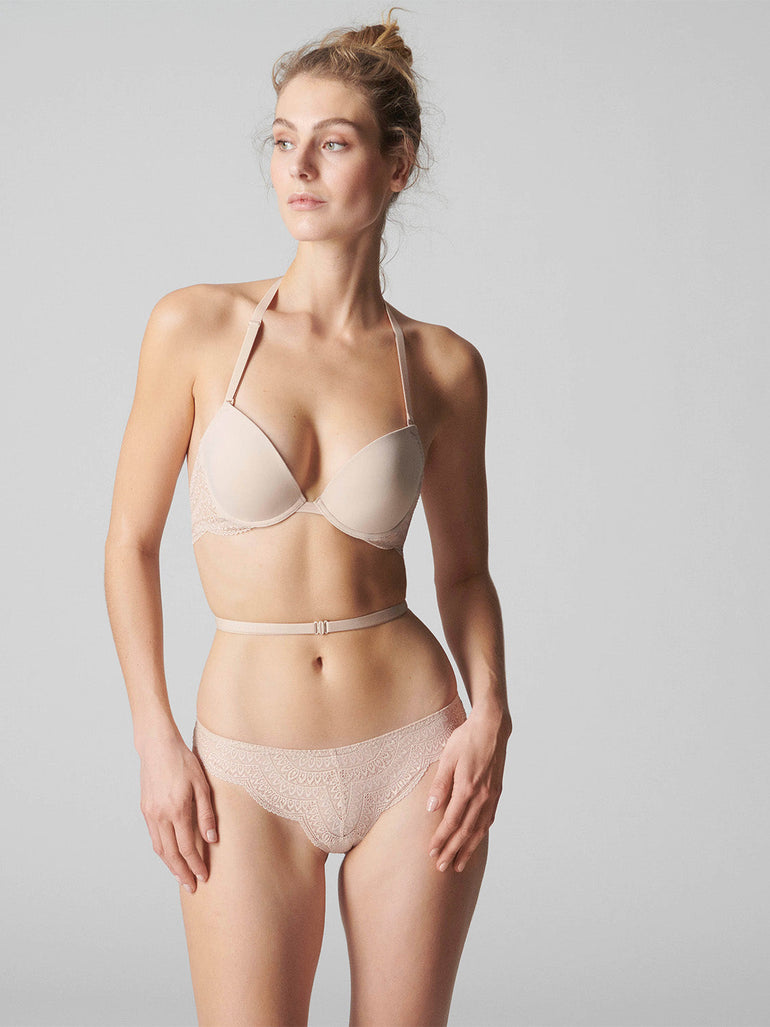 Model wearing 'Karma' Pale Pink Tanga, by Simone Pérèle (front view).