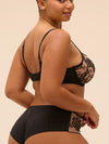 Model wearing 'Romance' Dark Brown Squared Neckline Full Cup Bra, by Simone Pérèle (side view).