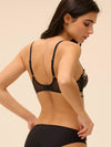 Model wearing 'Romance' Dark Brown Underwired Plunge Bra, by Simone Pérèle (back view).