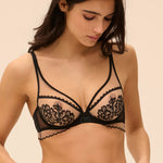 Model wearing 'Romance' Dark Brown Underwired Plunge Bra, by Simone Pérèle (front view).