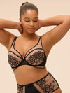 Fuller-figured model wearing 'Romance' Dark Brown Underwired Plunge Bra, by Simone Pérèle (front view).