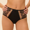 Model wearing 'Romance' Dark Brown Deep Brief, by Simone Pérèle (front view, close up).