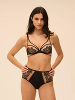 Model wearing 'Romance' Dark Brown Deep Brief, by Simone Pérèle (front view).