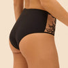 Model wearing 'Romance' Dark Brown Deep Brief, by Simone Pérèle (side view, close up).