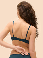Model wearing 'Saga' Teal Half Cup Bra, by Simone Pérèle (back view).