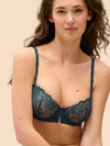 Model wearing 'Saga' Teal Half Cup Bra, by Simone Pérèle (front view).