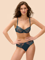 Model wearing 'Saga' Teal Half Cup Bra, by Simone Pérèle (front view).