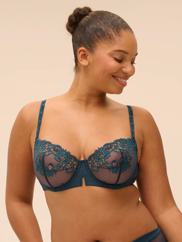 Model wearing 'Saga' Teal Half Cup Bra, by Simone Pérèle (front view).