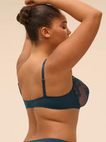 Model wearing 'Saga' Teal Half Cup Bra, by Simone Pérèle (side view).