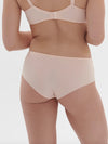 Model wearing 'Saga' Pale Pink Shorty, by Simone Pérèle (back view).
