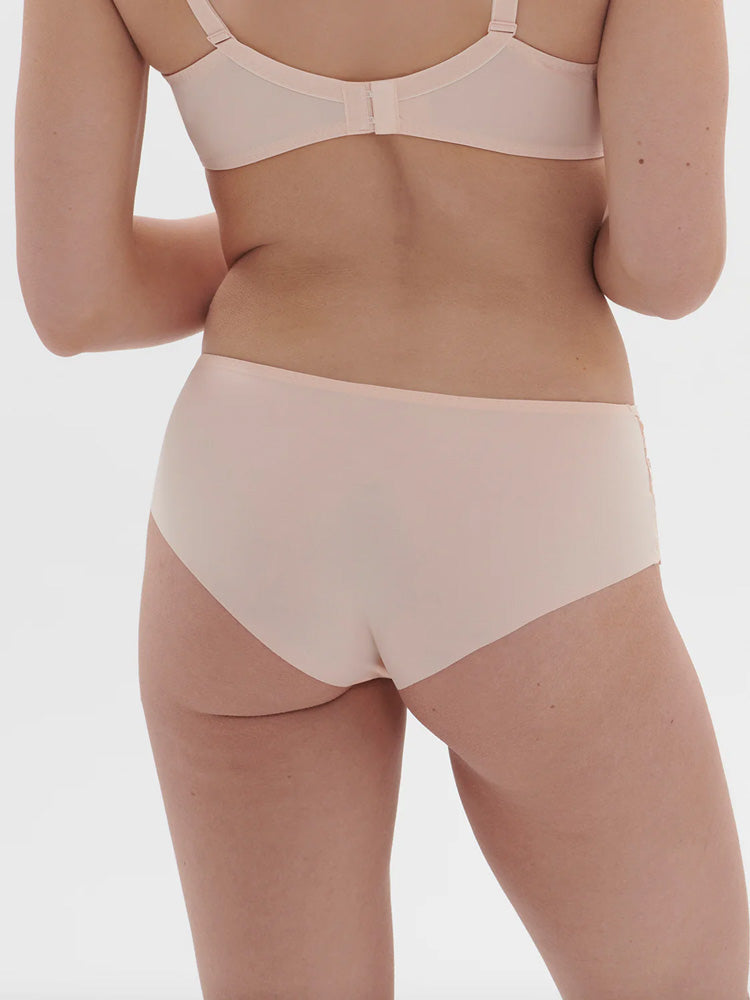 Model wearing 'Saga' Pale Pink Shorty, by Simone Pérèle (back view).