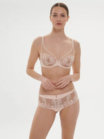 Model wearing 'Saga' Pale Pink Shorty, by Simone Pérèle (front view).