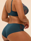 Model wearing 'Saga' Teal Shorty, by Simone Pérèle (back/side view).