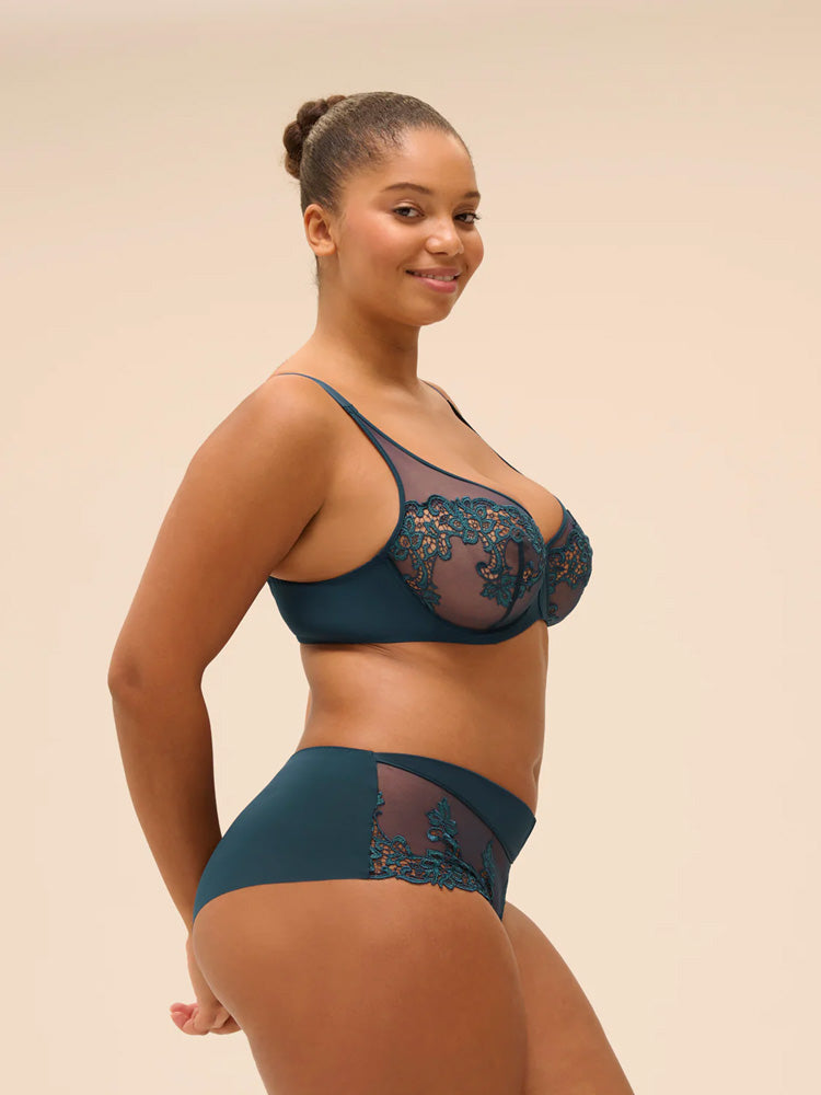 Model wearing 'Saga' Teal Shorty, by Simone Pérèle (side view).