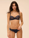 Model wearing 'Wish' Midnight Blue Half Cup Bra, by Simone Pérèle (front view).