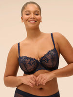 Model wearing 'Wish' Midnight Blue Half Cup Bra, by Simone Pérèle (front view).