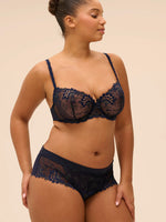 Model wearing 'Wish' Midnight Blue Half Cup Bra, by Simone Pérèle (front view).