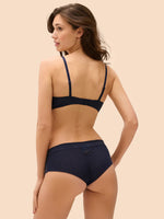 Model wearing 'Wish' Midnight Blue Plunging Push-Up Bra, by Simone Pérèle (back view).