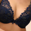 Model wearing 'Wish' Midnight Blue Plunging Push-Up Bra, by Simone Pérèle (front view, close up).