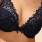 Model wearing 'Wish' Midnight Blue Plunging Push-Up Bra, by Simone Pérèle (front view, close up).