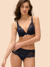 Model wearing 'Wish' Midnight Blue Plunging Push-Up Bra, by Simone Pérèle (front view).