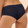 Model wearing 'Wish' Midnight Blue Shorty, by Simone Pérèle (back view, close up).