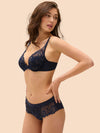 Model wearing 'Wish' Midnight Blue Shorty, by Simone Pérèle (side view).