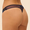 Model wearing 'Wish' Midnight Blue Tanga, by Simone Pérèle (back view, close up).