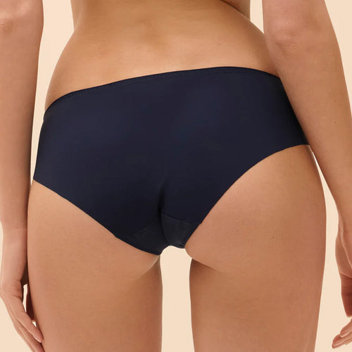 Model wearing 'Wish' Midnight Blue Brief, by Simone Pérèle  (back view, close up).