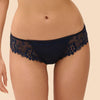 Model wearing 'Wish' Midnight Blue Brief, by Simone Pérèle  (front view, close up).