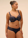Plus size model wearing 'Wish' Midnight Blue Brief, by Simone Pérèle  (front view).