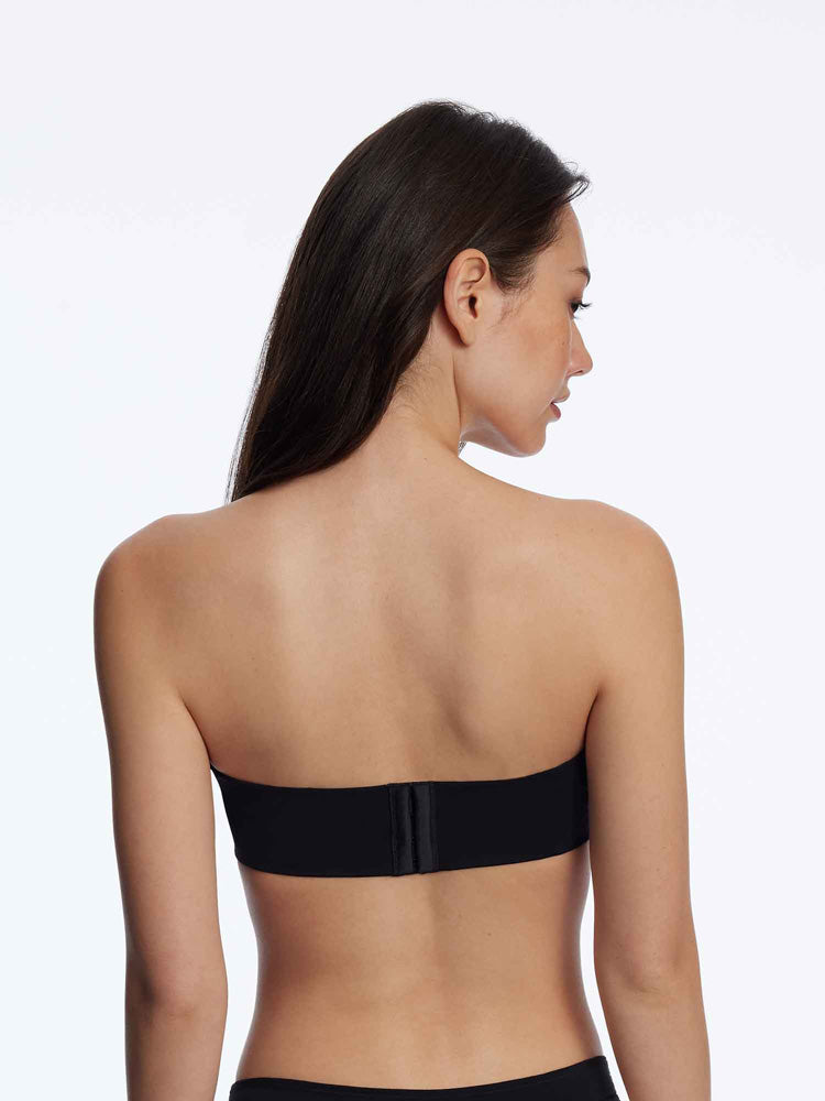 Model wearing 'Breathless' Black Strapless Plunge Push-up Bra, by Skarlett Blue (back view).