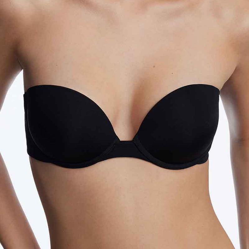 Model wearing 'Breathless' Black Strapless Plunge Push-up Bra, by Skarlett Blue (front view, close up).