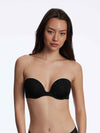 Model wearing 'Breathless' Black Strapless Plunge Push-up Bra, by Skarlett Blue (front view).