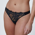 Model wearing 'Entice' Midnight Blue and Black Thong, by Skarlett Blue (front view, close up).