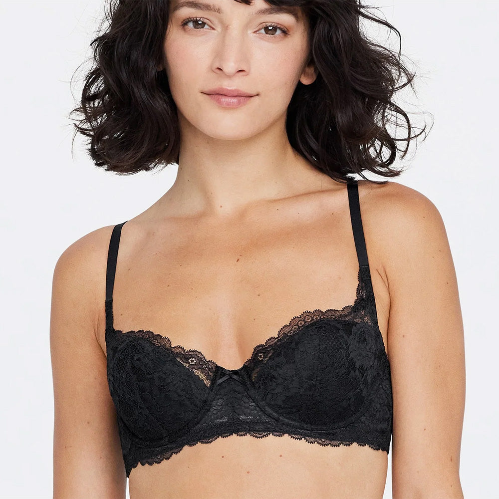Model wearing 'Minx' Black Padded Balconette Bra, by Skarlett Blue (front view).