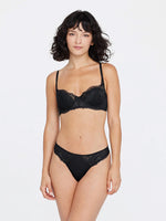 Model wearing 'Minx' Black Padded Balconette Bra, by Skarlett Blue (front view).