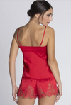 Model wearing red pyjama shorts from Lise Charmel's 'Splendeur Soie' collection (back view).